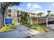 Building exterior showcasing parking and landscaping at 433 Cerromar Ln # 441, Venice, FL 34293