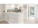 Modern condo kitchen with breakfast bar at 433 Cerromar Ln # 441, Venice, FL 34293