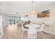 Living room with dining area and access to balcony at 433 Cerromar Ln # 441, Venice, FL 34293