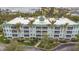 Coastal three-story building with balconies and waterfront views at 5115 Melbourne St # A206, Punta Gorda, FL 33980
