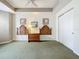 Bedroom with carpeted floor, ceiling fan, and dresser at 5115 Melbourne St # A206, Punta Gorda, FL 33980