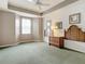 Bedroom with carpeted floor, ceiling fan, and dresser at 5115 Melbourne St # A206, Punta Gorda, FL 33980
