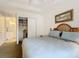 Spacious bedroom with king bed, closet, and access to a kitchenette at 5115 Melbourne St # A206, Punta Gorda, FL 33980