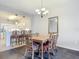 Dining room with wood table and wicker chairs at 5115 Melbourne St # A206, Punta Gorda, FL 33980