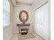 Bright entryway with mirror, console table, and closet at 5115 Melbourne St # A206, Punta Gorda, FL 33980