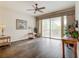 Living room with hardwood floors and balcony access at 5115 Melbourne St # A206, Punta Gorda, FL 33980