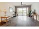 Living room with hardwood floors and balcony access at 5115 Melbourne St # A206, Punta Gorda, FL 33980