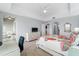 King-size bed in spacious bedroom with access to a balcony and partial water view at 5116 Melbourne St # B303, Punta Gorda, FL 33980