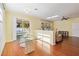 Bright dining area with glass table, pool view, and hardwood floors at 10043 Winding River Rd, Punta Gorda, FL 33950