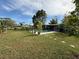 Spacious backyard with a refreshing pool and lush lawn at 107 Dunn Ne Dr, Port Charlotte, FL 33952