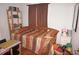Small bedroom with daybed and wooden shelving at 107 Dunn Ne Dr, Port Charlotte, FL 33952