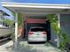 Covered carport area with space for one vehicle at 107 Dunn Ne Dr, Port Charlotte, FL 33952