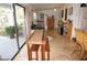 Dining area with wooden table and view of backyard at 107 Dunn Ne Dr, Port Charlotte, FL 33952