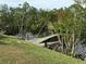Serene waterfront setting with a dock and canoe at 107 Dunn Ne Dr, Port Charlotte, FL 33952