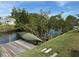 Relaxing waterfront view with a dock and canoe at 107 Dunn Ne Dr, Port Charlotte, FL 33952