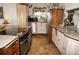 Modern kitchen with an island and stainless steel appliances at 107 Dunn Ne Dr, Port Charlotte, FL 33952