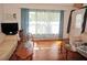Bright living room with hardwood floors and large windows at 107 Dunn Ne Dr, Port Charlotte, FL 33952