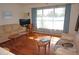 Bright living room with hardwood floors and large windows at 107 Dunn Ne Dr, Port Charlotte, FL 33952