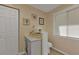 Toilet and storage space with a small cabinet at 12031 Hunter Ave, Port Charlotte, FL 33953