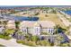 Aerial view of luxurious condo building near waterway at 1349 Aqui Esta Dr # 125, Punta Gorda, FL 33950