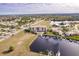 Bird's-eye view of a waterfront condo building with a pool and private boat slips at 1349 Aqui Esta Dr # 125, Punta Gorda, FL 33950