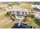 Aerial view of waterfront community with pool, boat slips, and upscale building at 1349 Aqui Esta Dr # 125, Punta Gorda, FL 33950