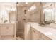 Bathroom with double vanity and large shower at 1349 Aqui Esta Dr # 125, Punta Gorda, FL 33950