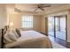 Main bedroom with king-size bed and access to balcony at 1349 Aqui Esta Dr # 125, Punta Gorda, FL 33950