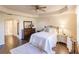 Bedroom with queen bed, dresser, and access to bathroom at 1349 Aqui Esta Dr # 125, Punta Gorda, FL 33950