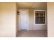 Front door entrance with white door and window at 1349 Aqui Esta Dr # 125, Punta Gorda, FL 33950