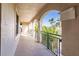Covered walkway with arched openings and tropical views at 1349 Aqui Esta Dr # 125, Punta Gorda, FL 33950