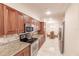 Kitchen boasting stainless steel appliances and granite countertops at 1349 Aqui Esta Dr # 125, Punta Gorda, FL 33950