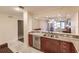 Open kitchen with stainless steel appliances and granite countertops at 1349 Aqui Esta Dr # 125, Punta Gorda, FL 33950