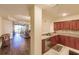 Open concept kitchen with granite countertops and stainless steel appliances at 1349 Aqui Esta Dr # 125, Punta Gorda, FL 33950
