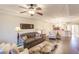 Spacious living room with hardwood floors and comfy seating at 1349 Aqui Esta Dr # 125, Punta Gorda, FL 33950