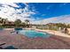 Community pool with spa and surrounding patio at 1349 Aqui Esta Dr # 125, Punta Gorda, FL 33950