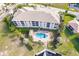 Luxury condo building with community pool, boat slips, and lush landscaping at 1349 Aqui Esta Dr # 125, Punta Gorda, FL 33950