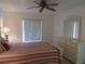 Spacious bedroom with ceiling fan and dresser at 1360 Rio De Janeiro Ave # 117, Punta Gorda, FL 33983