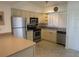 Bright kitchen features stainless steel appliances and light cabinets at 1360 Rio De Janeiro Ave # 117, Punta Gorda, FL 33983