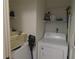 Small laundry room with washer and dryer at 1360 Rio De Janeiro Ave # 117, Punta Gorda, FL 33983