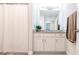 Clean bathroom with granite countertop, white cabinets, and shower at 14009 Black Beauty Dr # 212, Punta Gorda, FL 33955