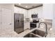 Modern kitchen with white cabinets and granite countertops at 14009 Black Beauty Dr # 212, Punta Gorda, FL 33955