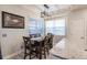 Bright dining area with a wooden table and four chairs at 14009 Black Beauty Dr # 212, Punta Gorda, FL 33955