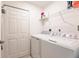 Laundry room with washer, dryer, and additional shelving at 14009 Black Beauty Dr # 212, Punta Gorda, FL 33955
