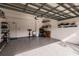 Two-car garage featuring built-in shelving and a utility sink at 14009 Black Beauty Dr # 212, Punta Gorda, FL 33955