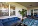Relaxing screened patio with comfortable seating and lake view at 14009 Black Beauty Dr # 212, Punta Gorda, FL 33955