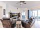 Spacious living room with leather furniture and large TV at 14009 Black Beauty Dr # 212, Punta Gorda, FL 33955