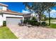 Townhouse with two-car garage and brick paver driveway at 14009 Black Beauty Dr # 212, Punta Gorda, FL 33955