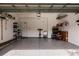 Spacious garage with ample storage shelving and epoxy floor at 14009 Black Beauty Dr # 212, Punta Gorda, FL 33955