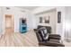 Game room featuring a retro arcade game, comfortable seating, and hardwood floors at 14009 Black Beauty Dr # 212, Punta Gorda, FL 33955